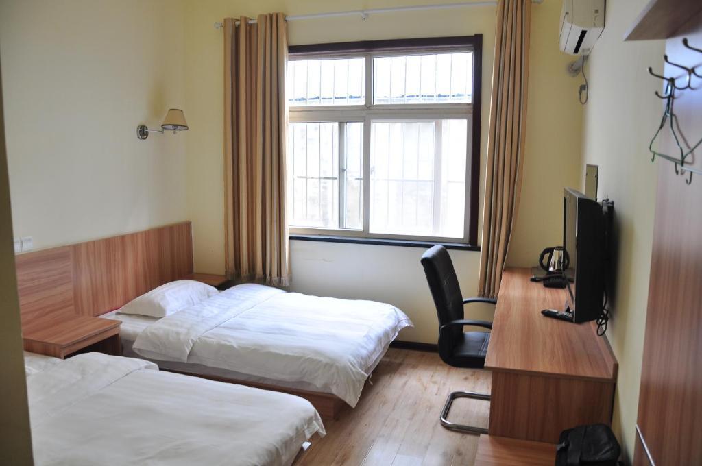 Qingdao Youxin Airport Hotel Xinzheng Road Room photo